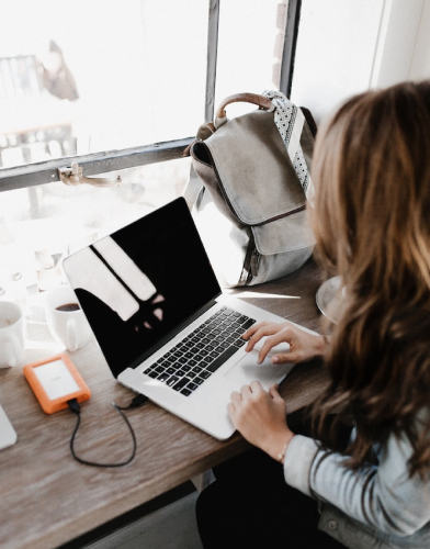 developer-at-work woman developer look at a macbook pro